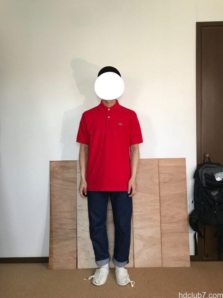 3度洗濯したラコステのポロシャツL1212のサイズ5とリーバイス501を着た人